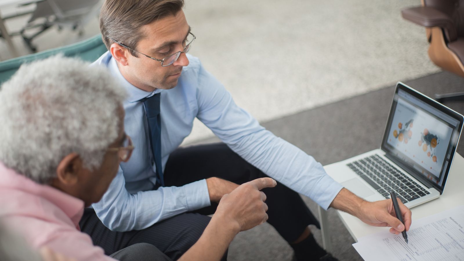 IT consultant and business owner reviewing a technology project plan in Calgary
