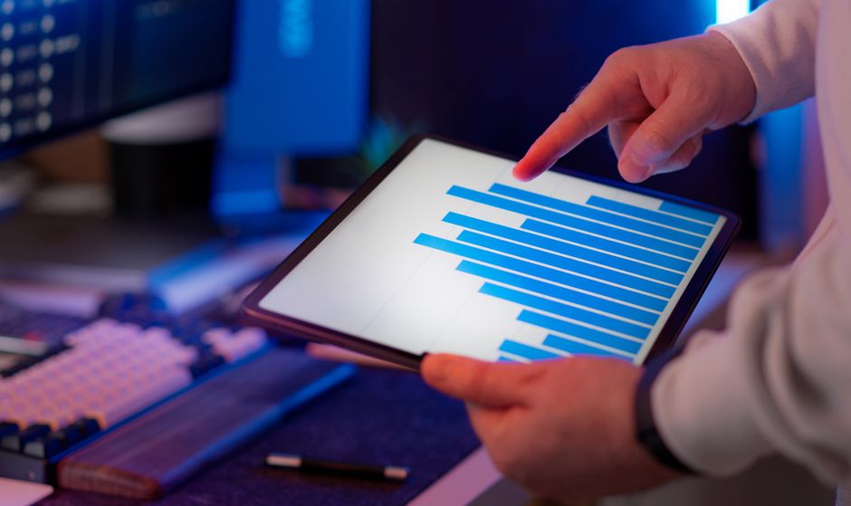 Engineer reviewing an asset management data dashboard on a tablet