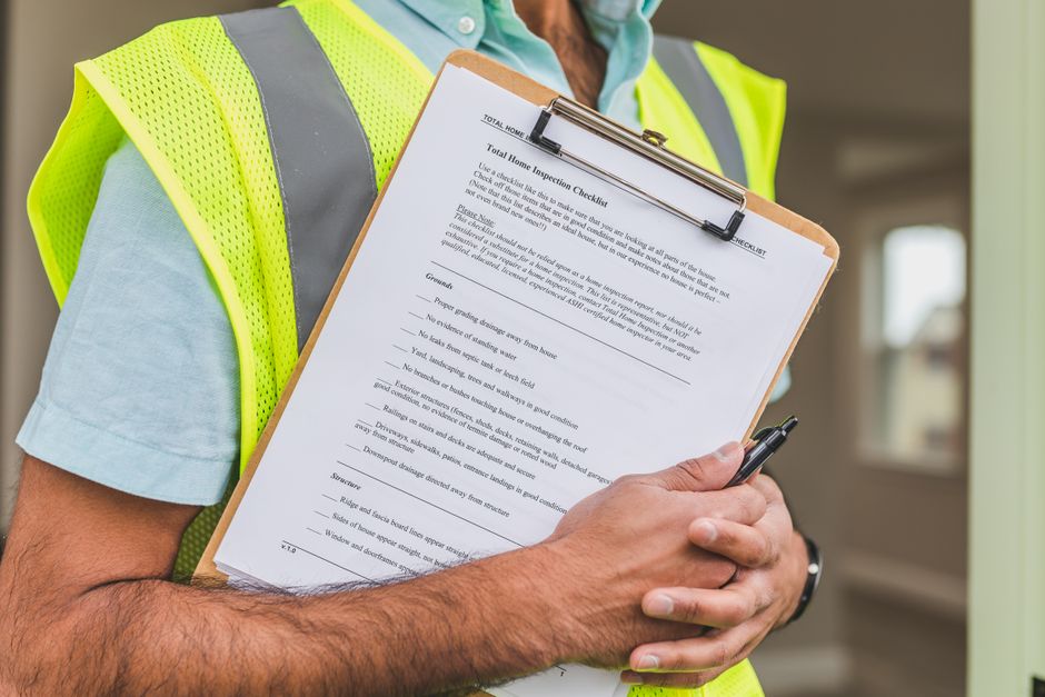 Safety inspector reviewing an industrial risk assessment checklist