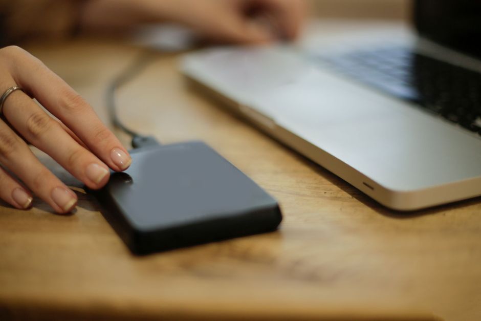 External backup drive connected to a laptop