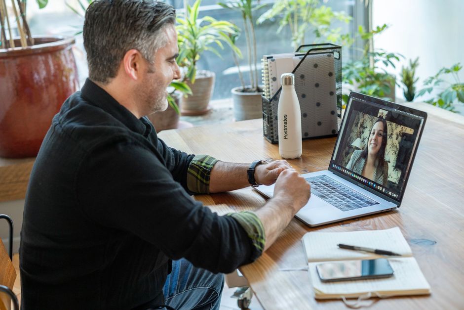Business owner on a video call with a remote IT provider