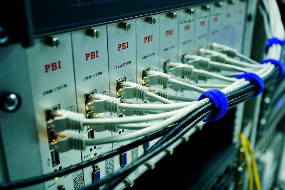 Network switch and patch panel with connected ethernet cables